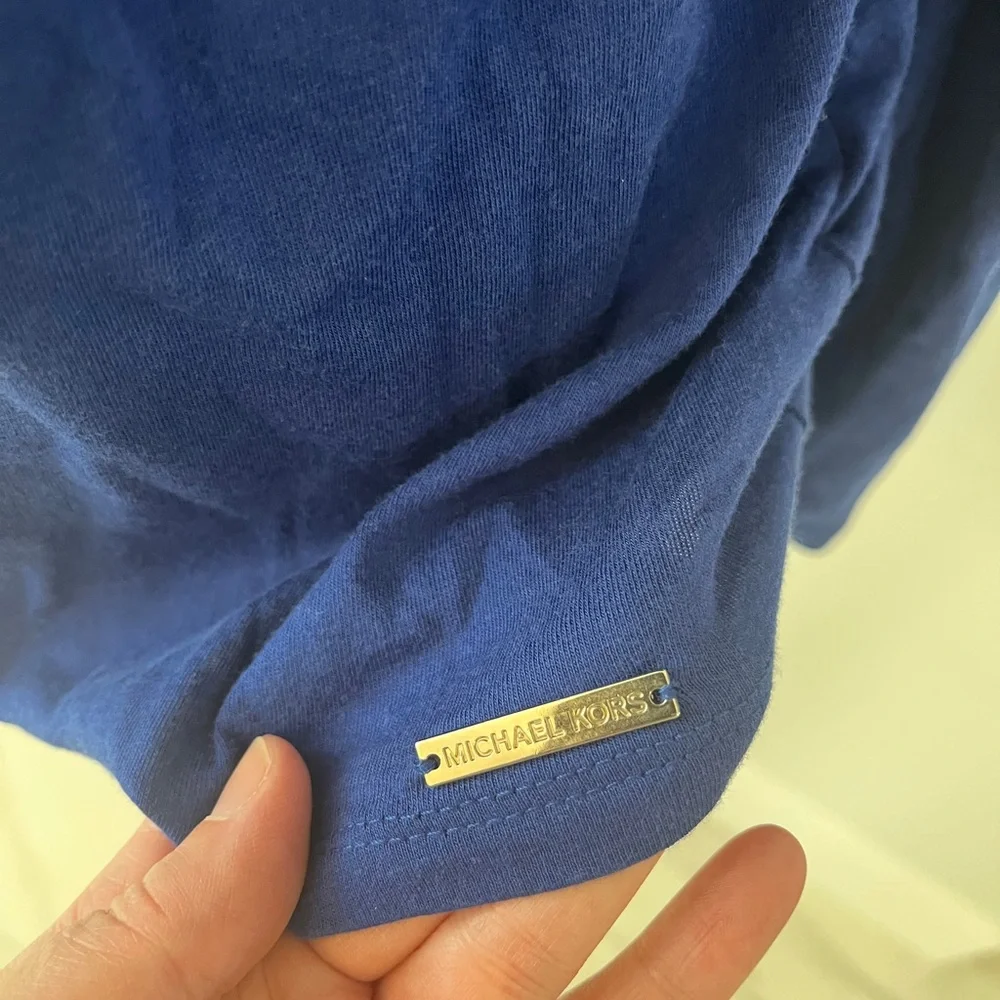 Women’s size medium blue Michael Kors cutout shoulder top